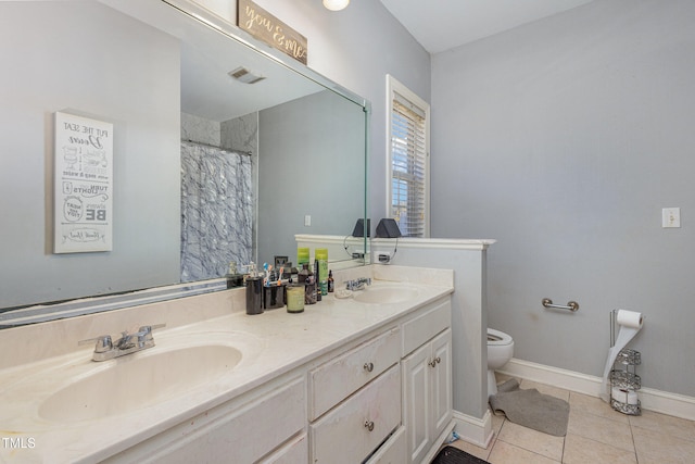 bathroom featuring vanity, a shower with shower curtain, tile patterned floors, and toilet