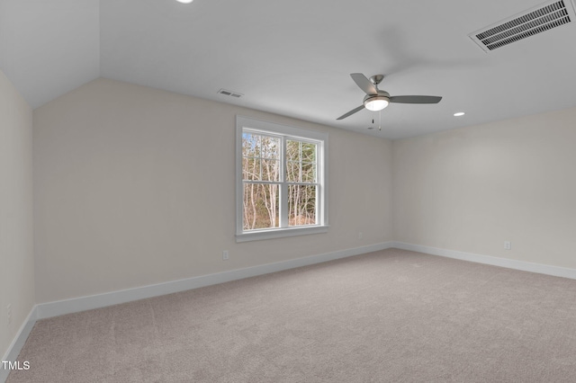 unfurnished room with ceiling fan and light colored carpet