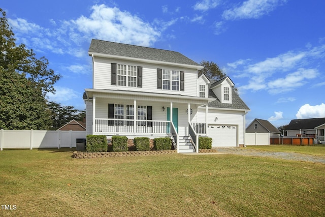 view of front of home with a front lawn, central air condition unit, and a porch