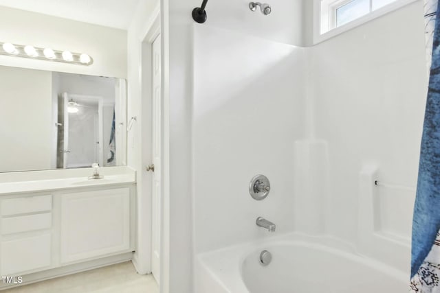 bathroom with vanity and shower / bathtub combination with curtain