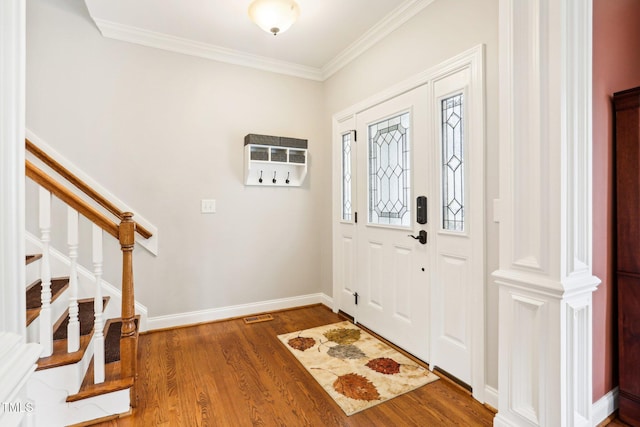 foyer entrance featuring wood-type flooring and ornamental molding