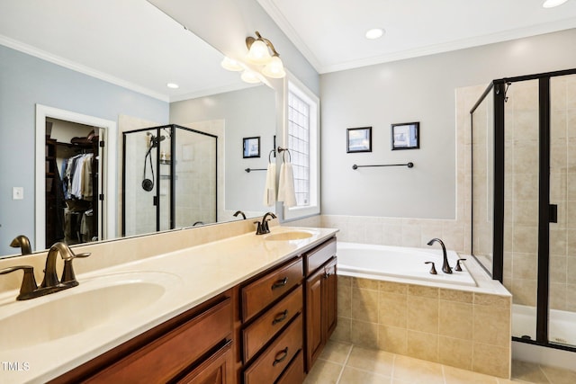 bathroom featuring tile patterned floors, vanity, shower with separate bathtub, and crown molding