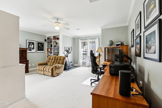 office featuring carpet flooring, ceiling fan, and crown molding