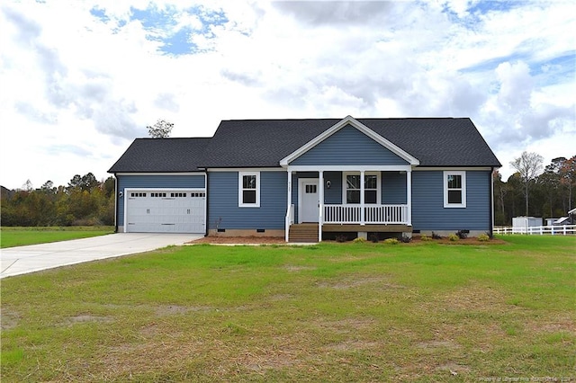 view of front of house featuring a garage, a front yard, and a porch