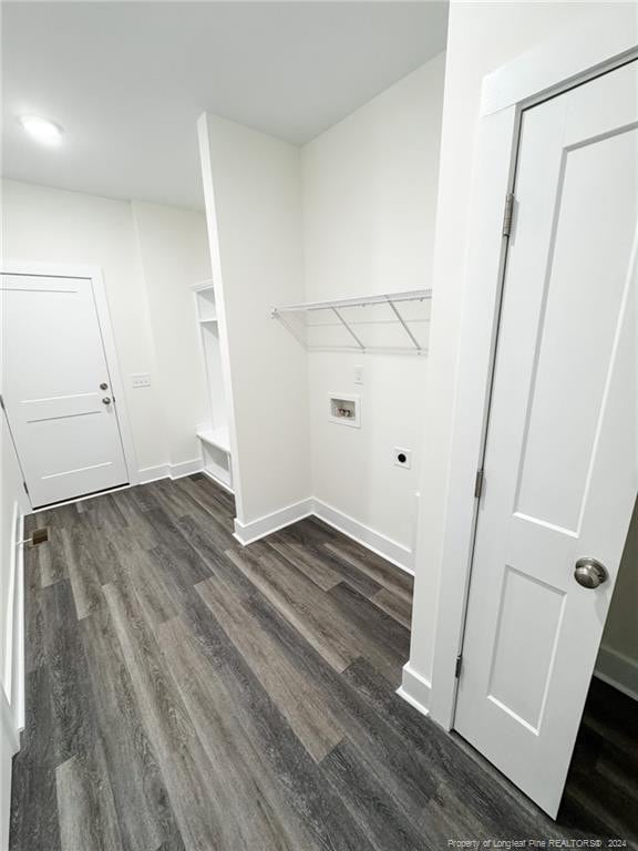 laundry room featuring dark hardwood / wood-style floors, hookup for a washing machine, and hookup for an electric dryer