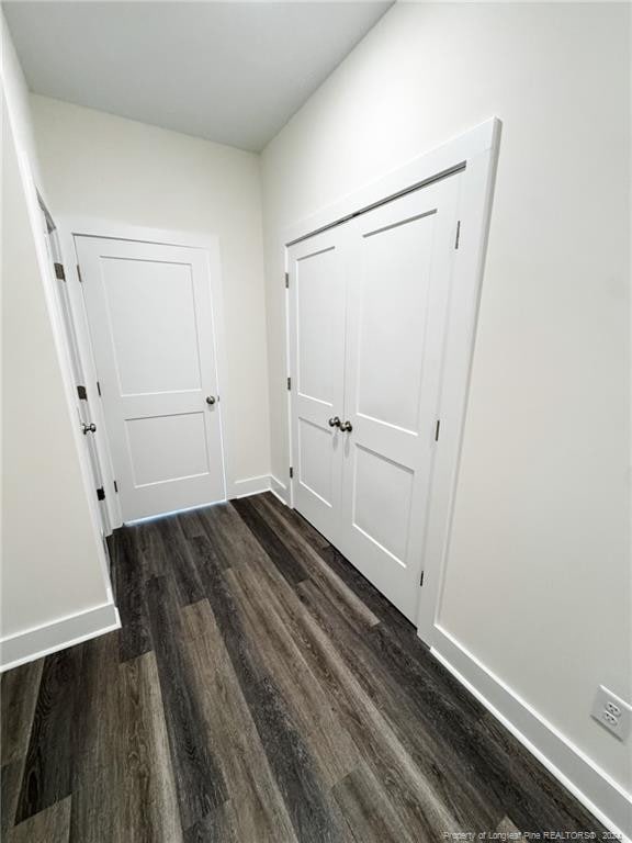 hall with dark hardwood / wood-style flooring