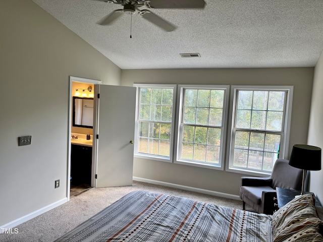 unfurnished room featuring ceiling fan, a textured ceiling, light carpet, and lofted ceiling