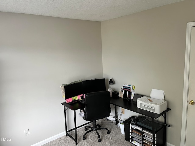 office with carpet and a textured ceiling