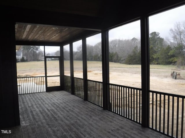 unfurnished sunroom with wooden ceiling