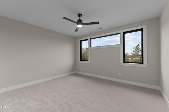 carpeted empty room with ceiling fan