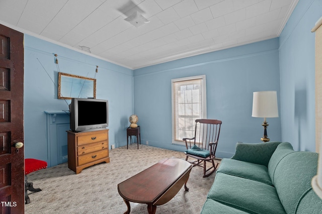 carpeted living room with crown molding