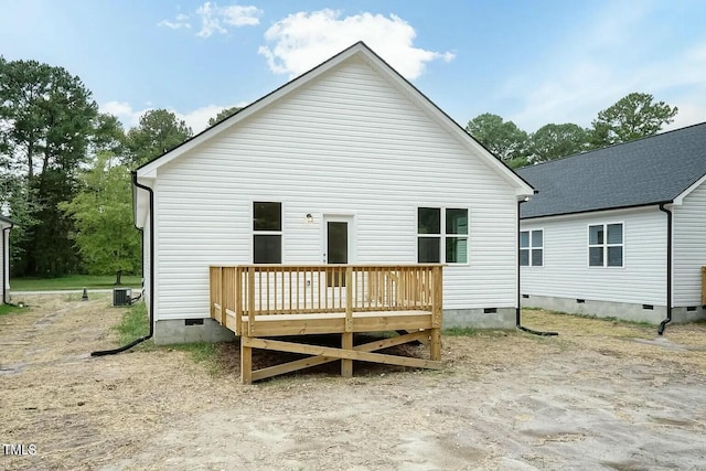 back of property with central air condition unit and a wooden deck