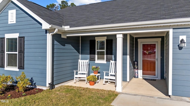 property entrance with covered porch