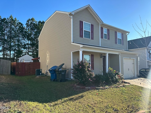 view of front of house featuring a garage and a front lawn