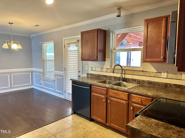 kitchen with light hardwood / wood-style floors, sink, black appliances, backsplash, and crown molding