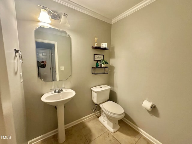 bathroom featuring ornamental molding, toilet, and tile patterned floors