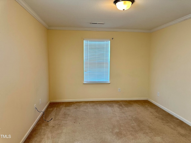 carpeted spare room with ornamental molding