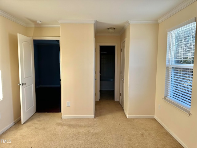 unfurnished bedroom featuring ornamental molding and light carpet