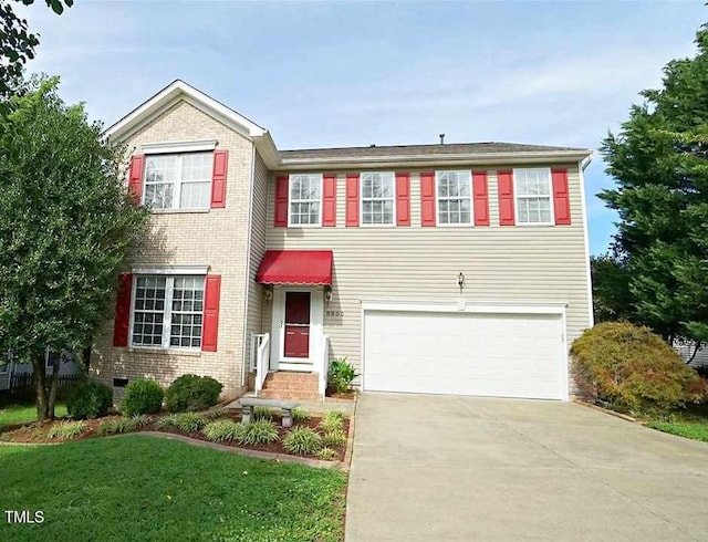 view of front facade featuring a garage and a front yard