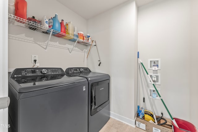 washroom with washer and clothes dryer