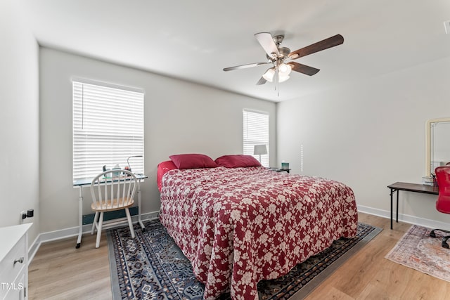 bedroom featuring light wood-type flooring and ceiling fan