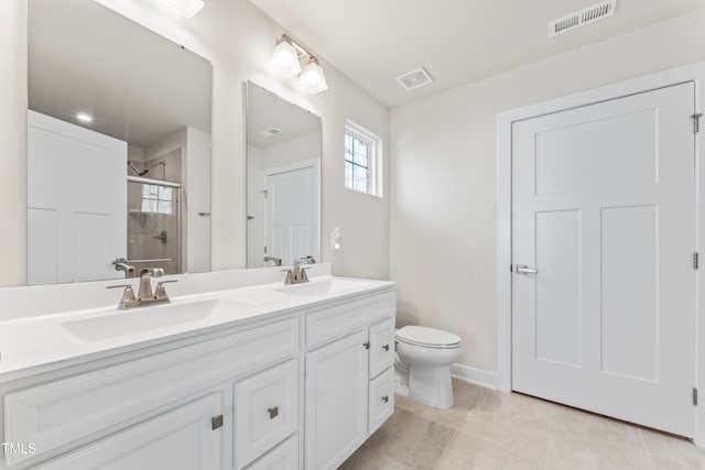 bathroom with walk in shower, toilet, vanity, and tile patterned floors