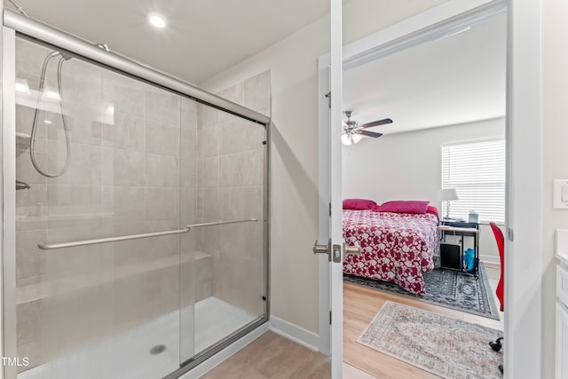 bathroom featuring an enclosed shower, vanity, hardwood / wood-style flooring, and ceiling fan