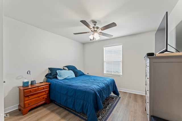 bedroom featuring light hardwood / wood-style flooring and ceiling fan