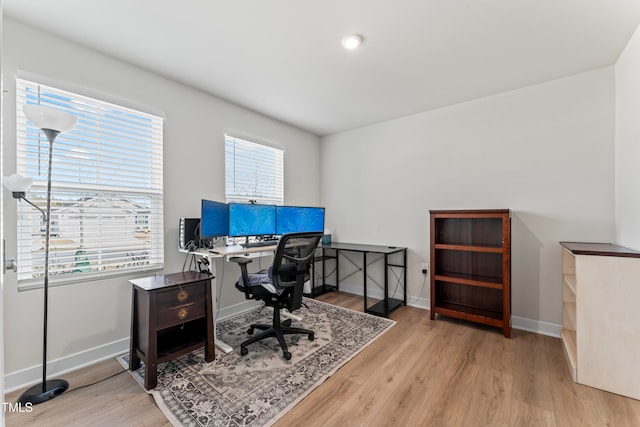 home office with light wood-type flooring