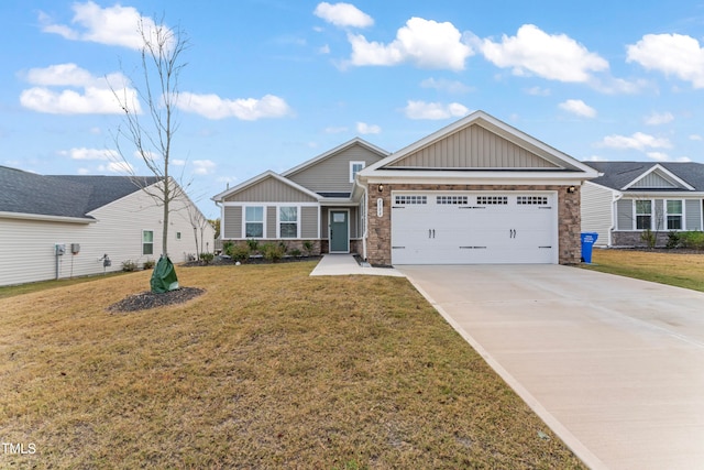 view of front of house with a front yard and a garage