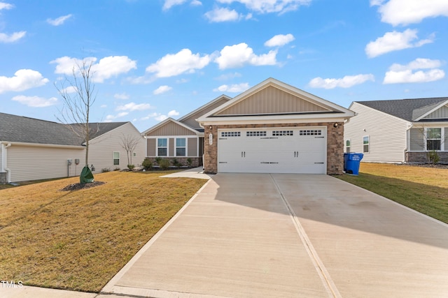 view of front of house featuring a garage and a front yard