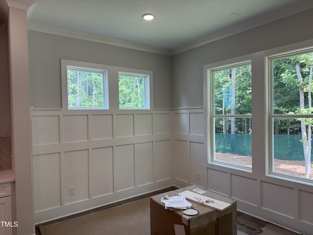122 Sanderway Dr, Chapel Hill, NC 27516 - unfurnished room with a decorative wall, healthy amount of natural light, ornamental molding, recessed lighting, and wainscoting