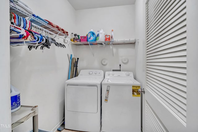 clothes washing area with independent washer and dryer