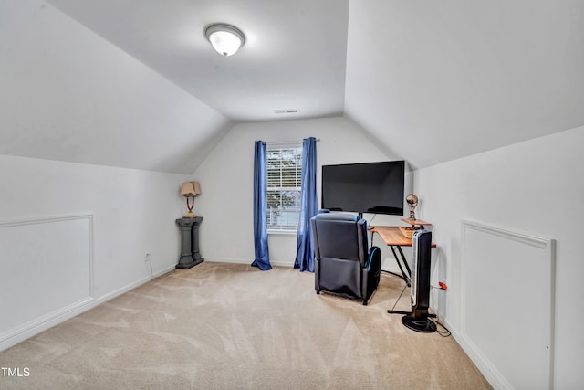 office featuring light colored carpet and vaulted ceiling