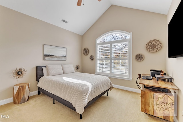 bedroom featuring light colored carpet, lofted ceiling, and ceiling fan