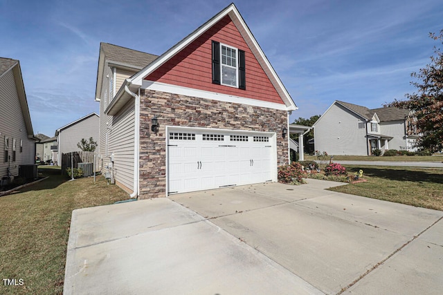 view of property exterior with a garage, a lawn, and central AC