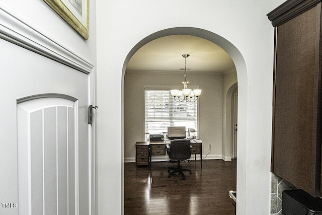 office space with crown molding, a notable chandelier, and dark hardwood / wood-style flooring