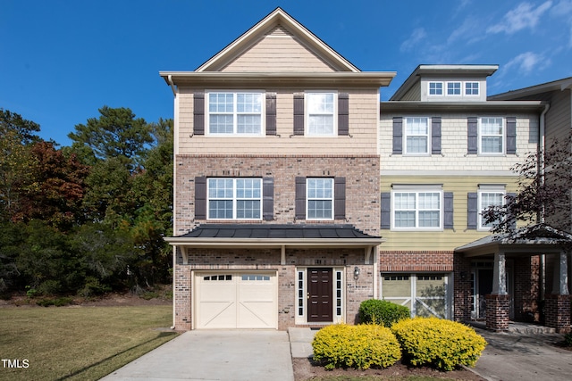 view of front of home featuring a garage and a front yard