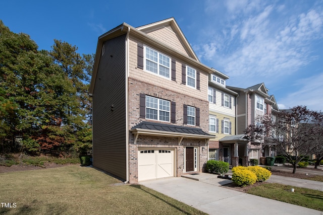 multi unit property featuring a garage and a front yard