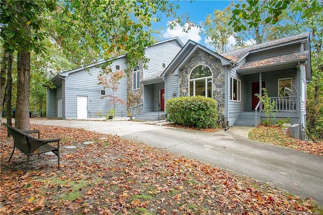 view of front of home featuring a porch and a garage