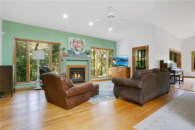 living room featuring light wood-type flooring and ceiling fan