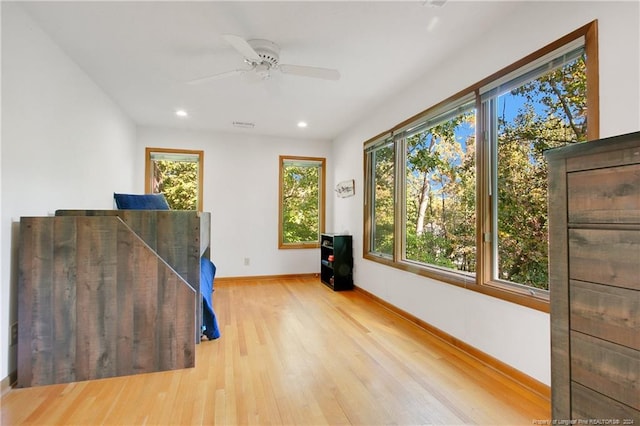 miscellaneous room with ceiling fan and light hardwood / wood-style flooring