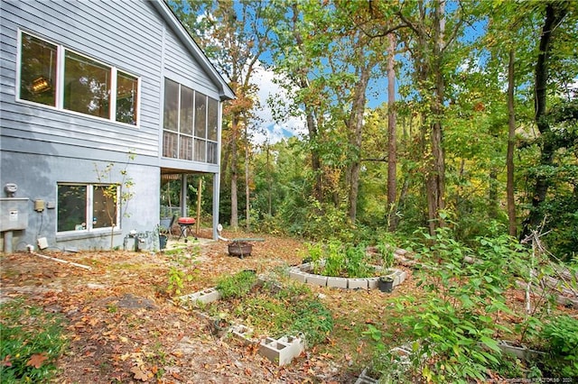 view of yard with a sunroom