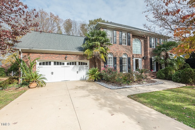 colonial inspired home featuring a garage