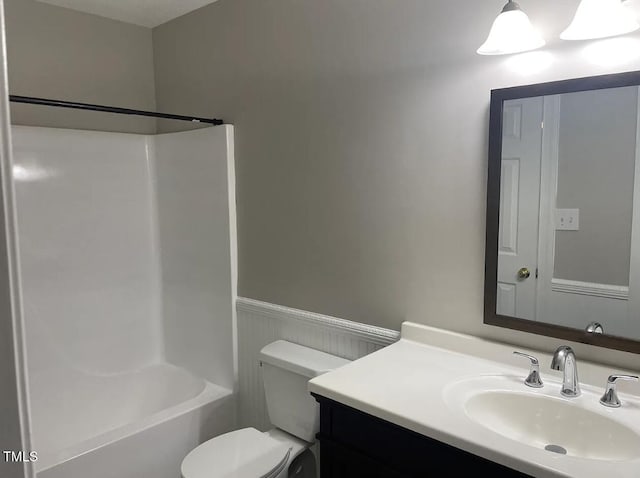 full bathroom featuring shower / bath combination, vanity, and toilet