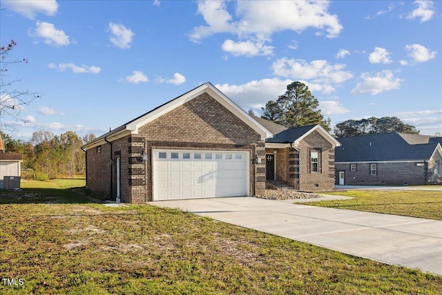 single story home featuring a front yard and a garage