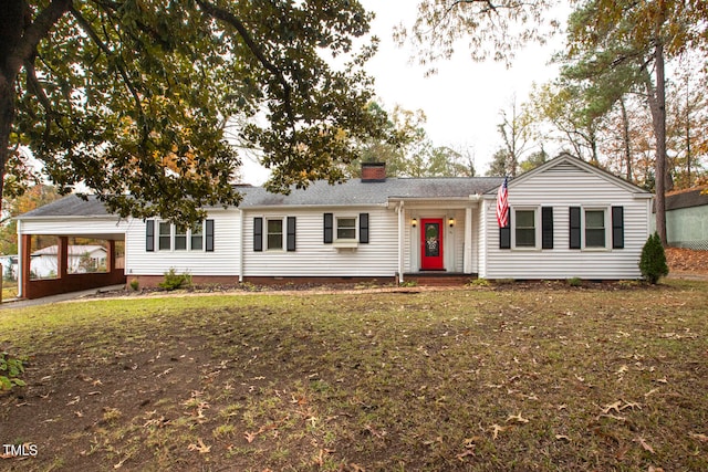 ranch-style home with a carport