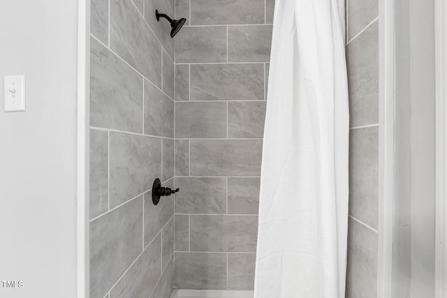 bathroom featuring a shower with curtain