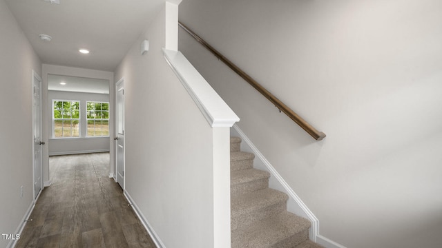 stairway with hardwood / wood-style flooring