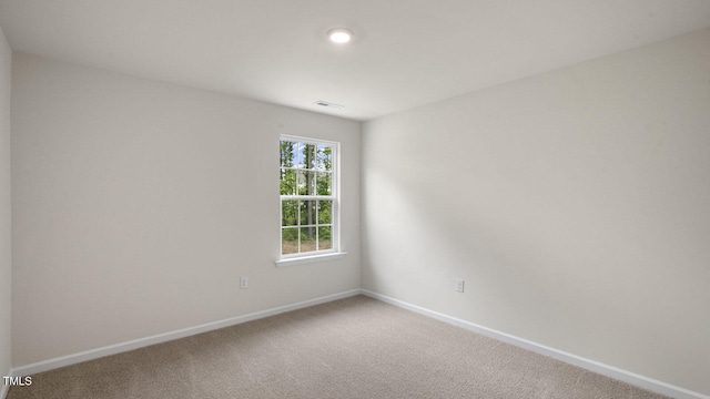 empty room featuring carpet flooring